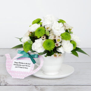 Teacup and Saucer with White Spray Roses, Lime Santini, White Waxflower, Rustic Ruscus